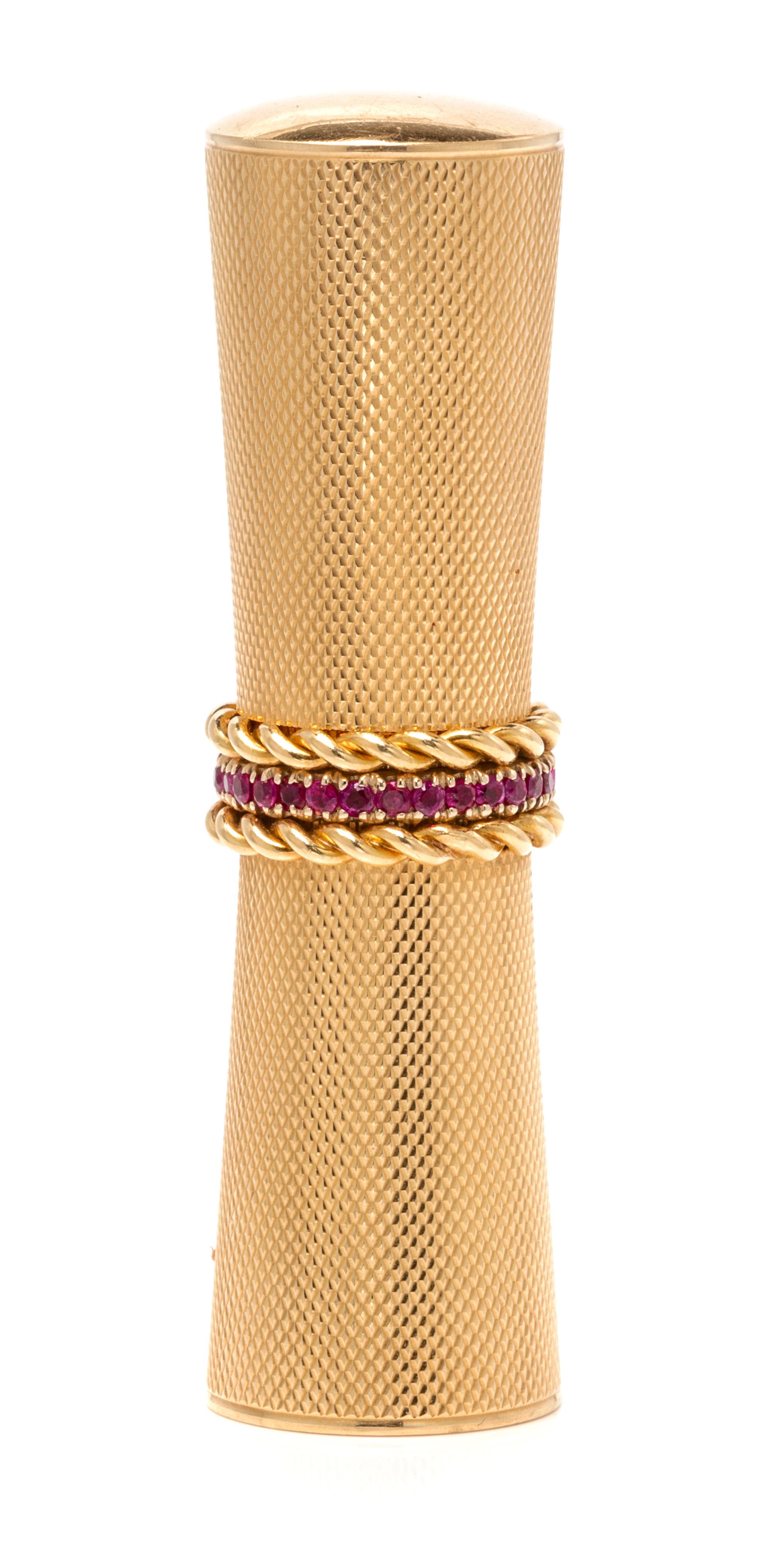 An 18 Karat Yellow Gold and Ruby Lipstick Holder, Van Cleef & Arpels, New York, 24.00 dwts.