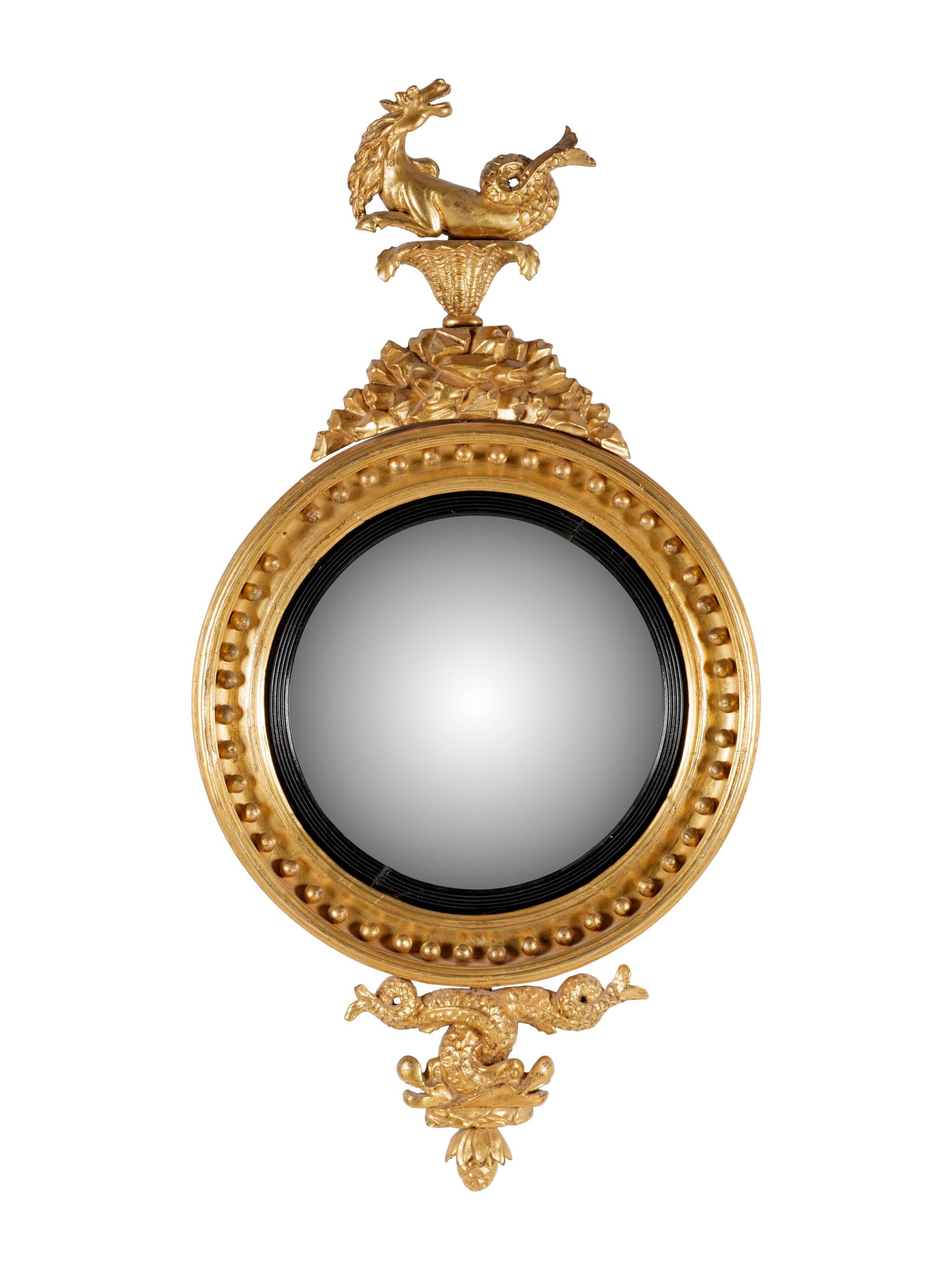 A George III Carved Giltwood Sea Dragon Bull's Eye Mirror