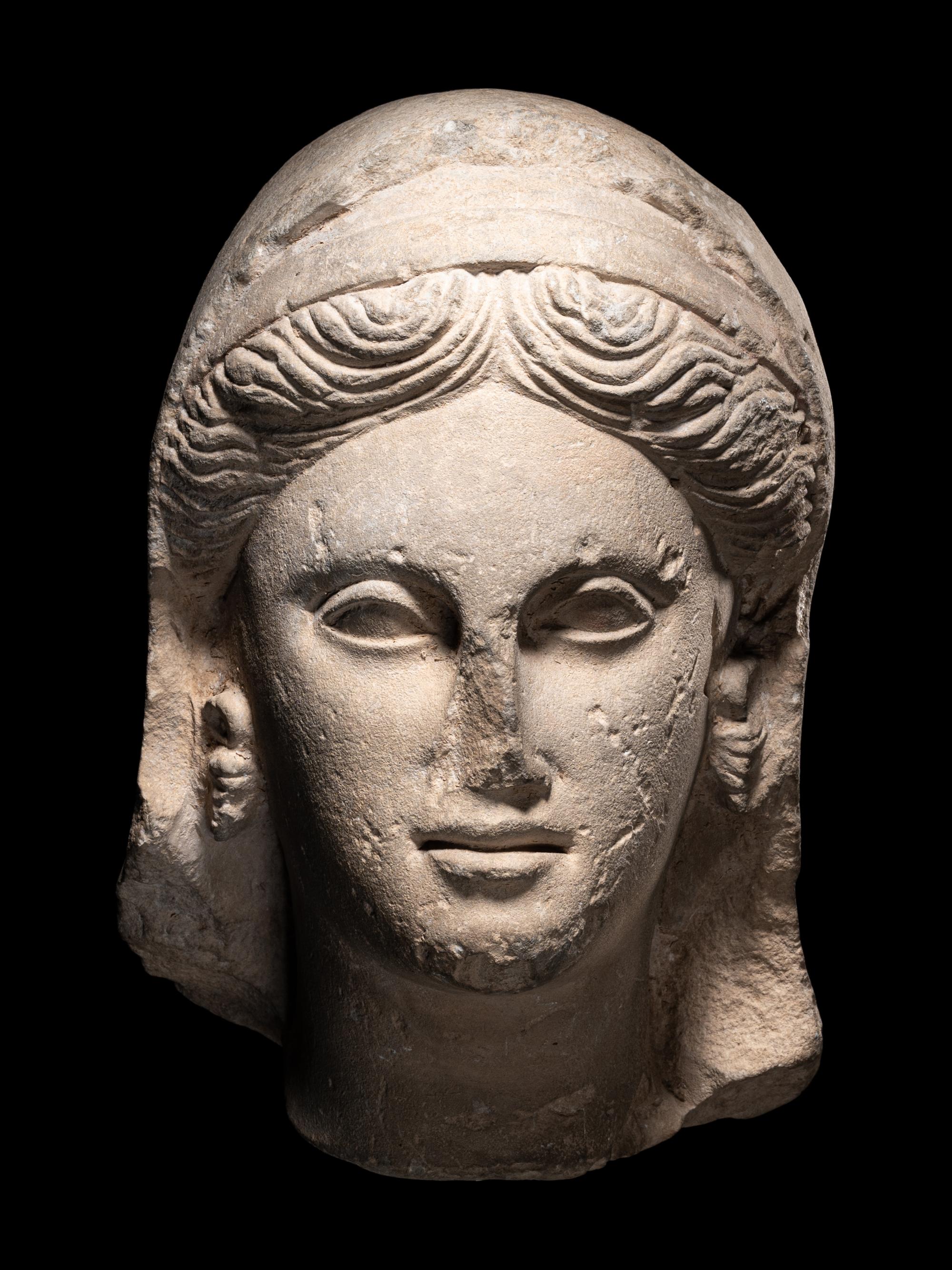 A Greek Limestone Head of a Woman