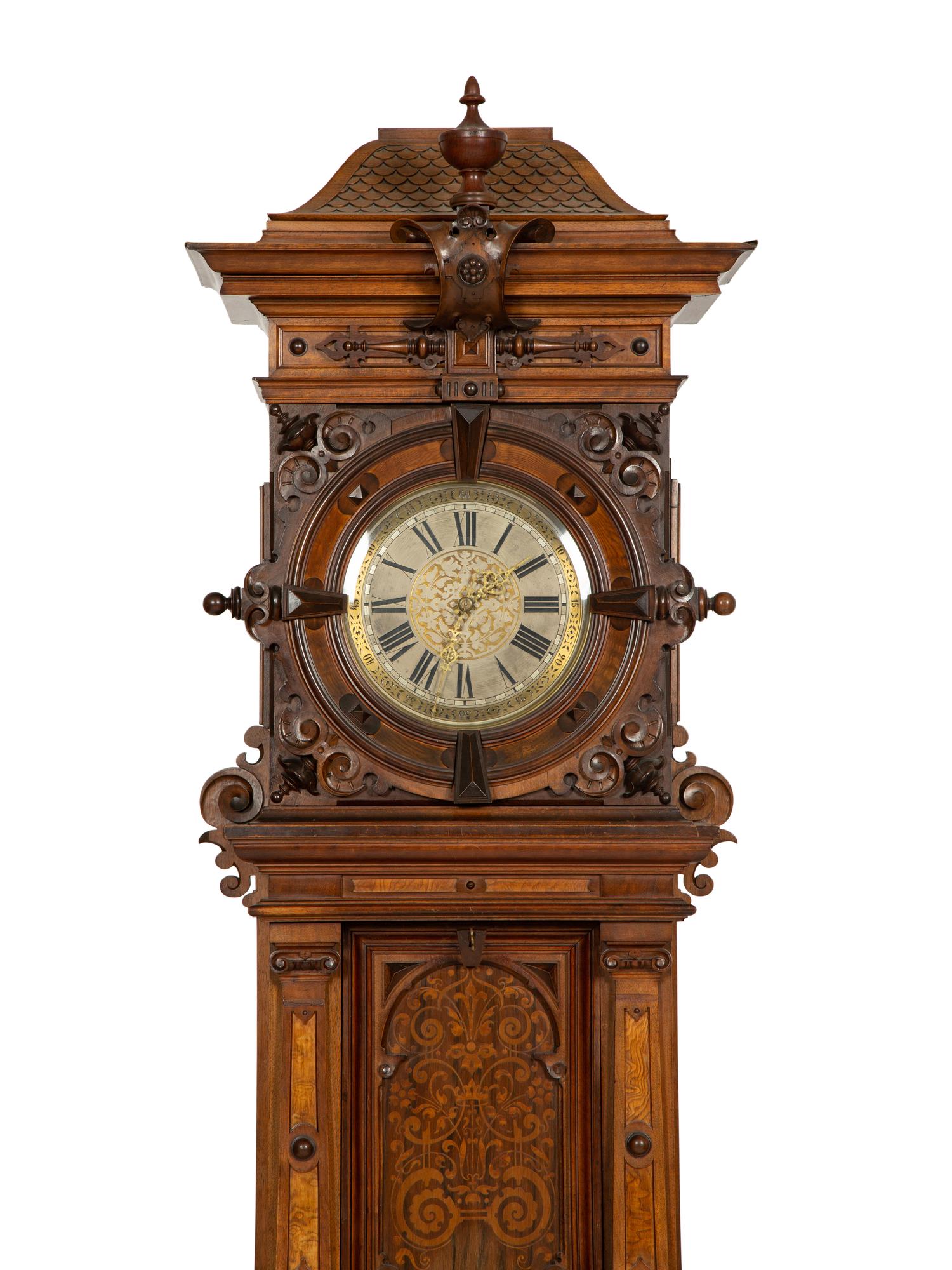 A German Carved Walnut and Marquetry Tall Case Clock
