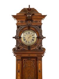 A German Carved Walnut and Marquetry Tall Case Clock