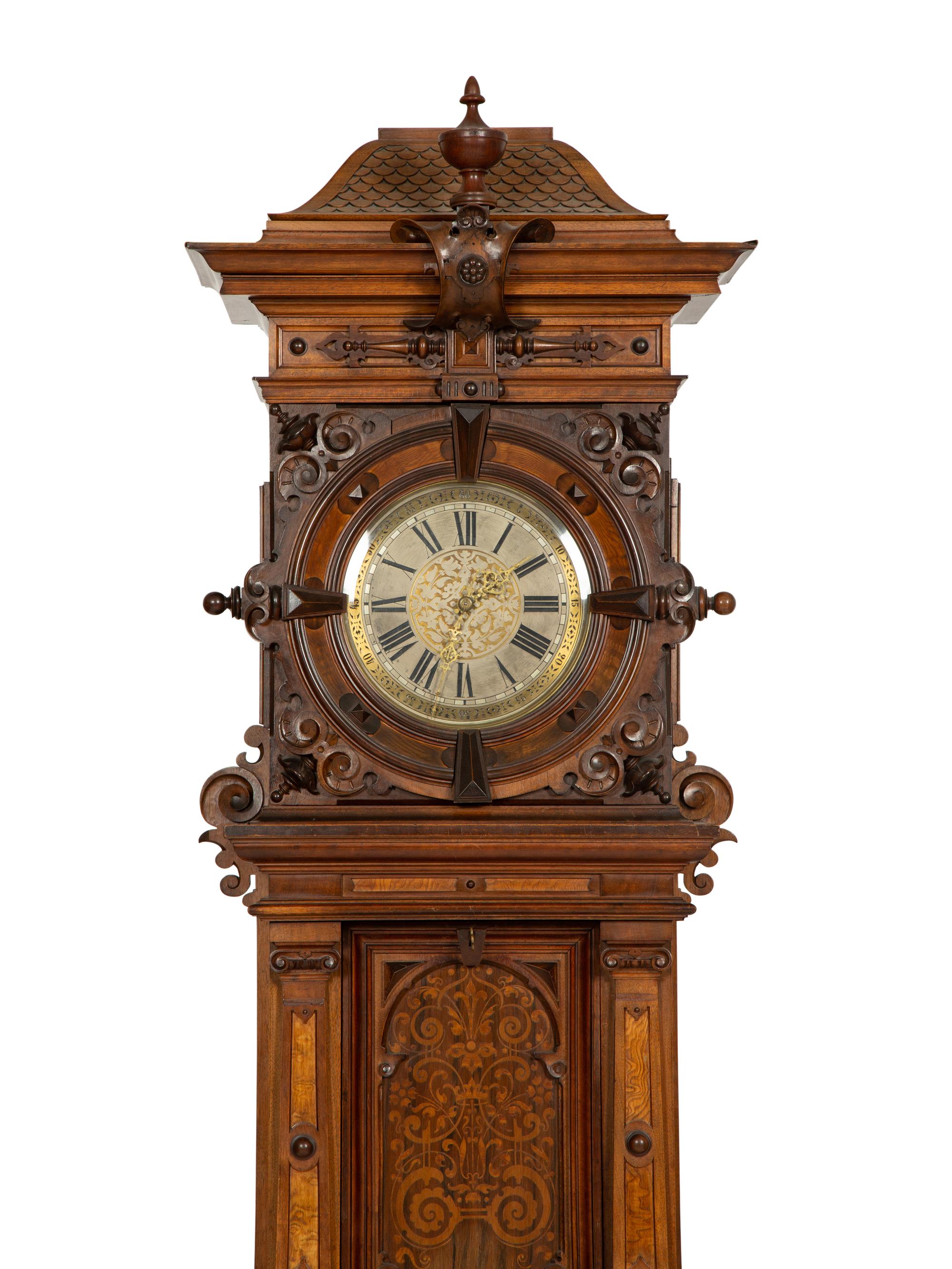 A German Carved Walnut and Marquetry Tall Case Clock