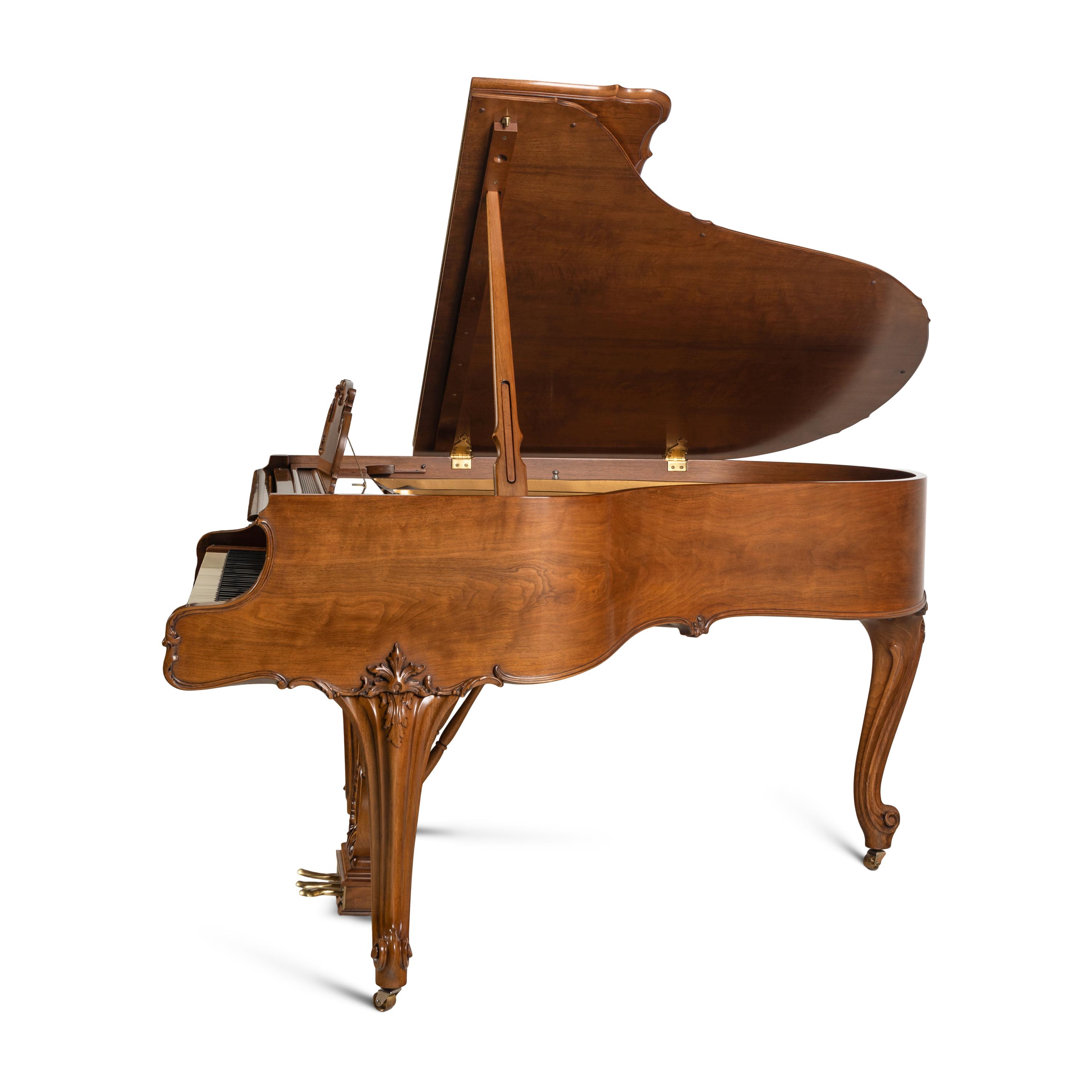 A Steinway and Sons Walnut Grand Piano