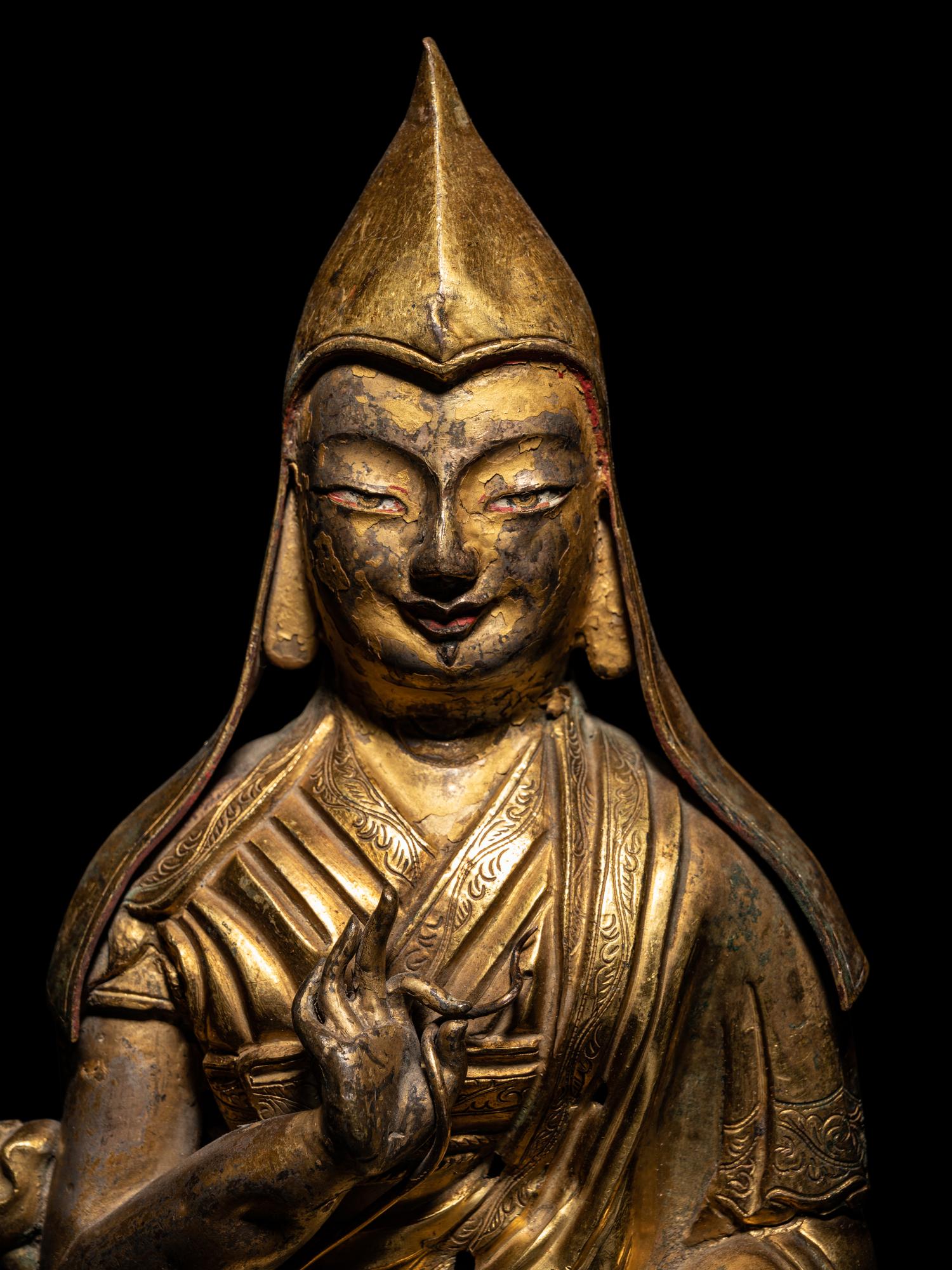 A Tibetan Gilt Bronze Repoussé Seated Figure of Tsongkhapa