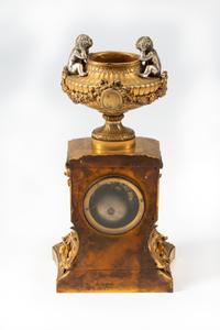 A French Gilt Bronze and Specimen Marble Clock