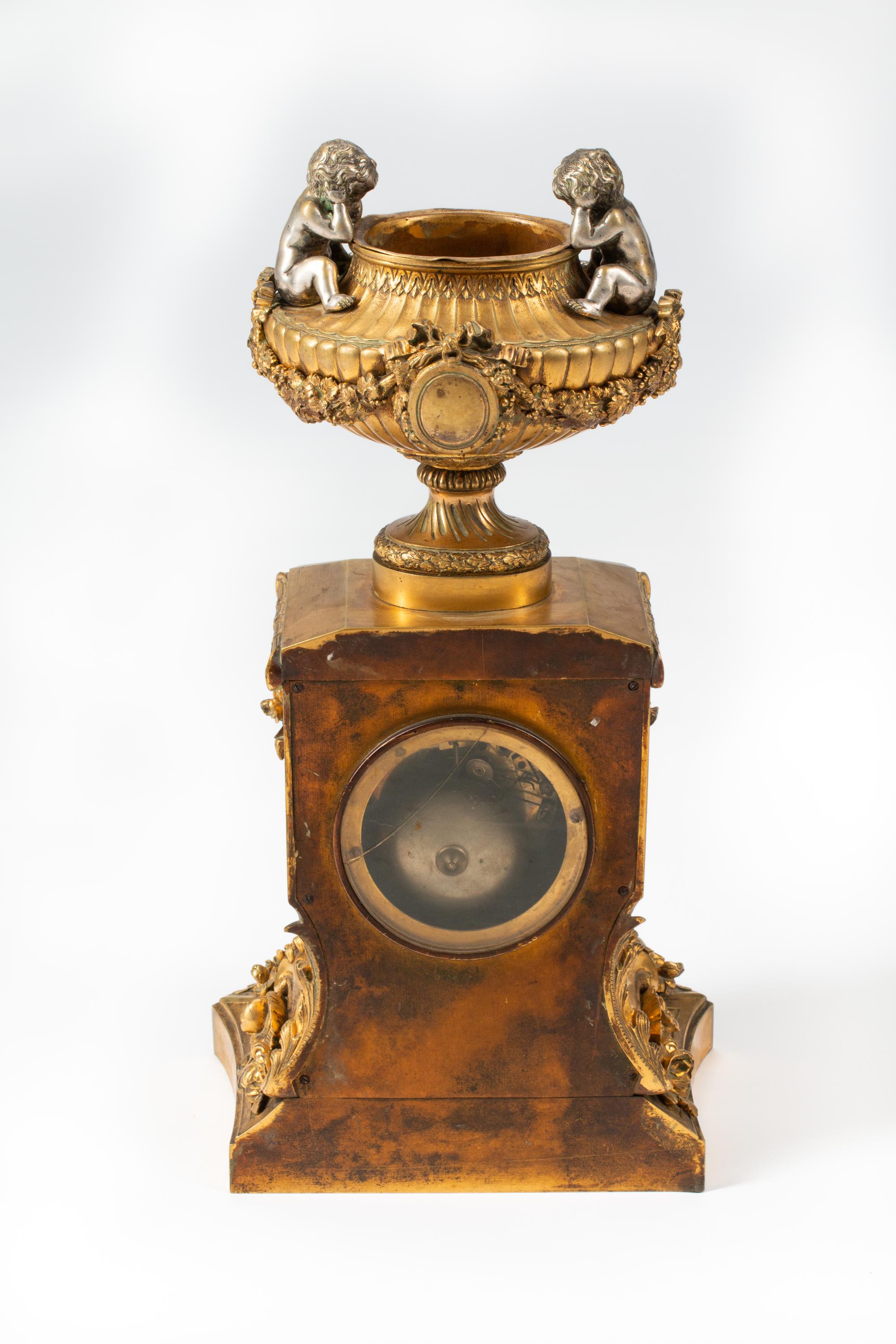 A French Gilt Bronze and Specimen Marble Clock