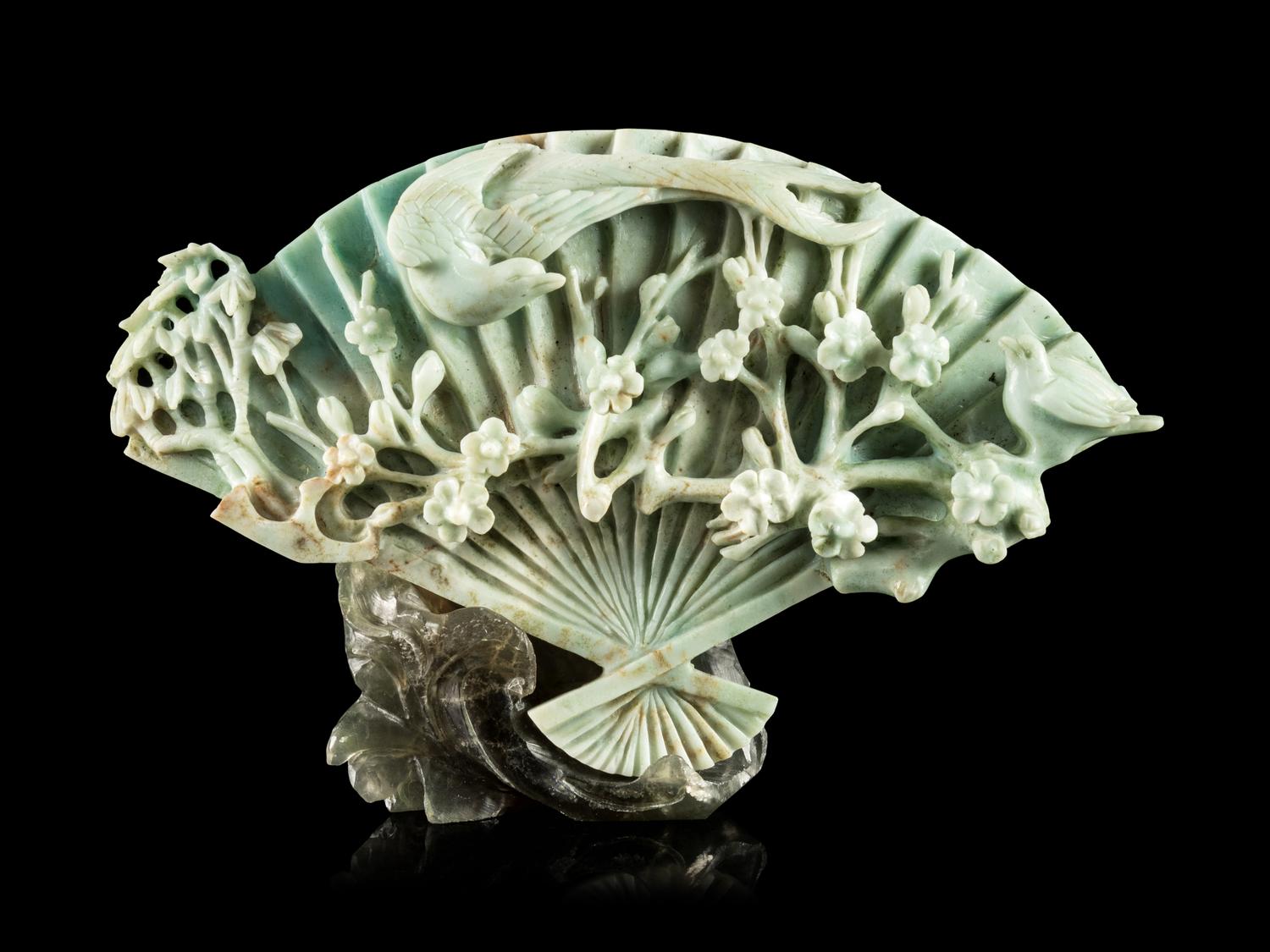 A Chinese Apple Green and Celadon Jadeite Fan-Form Carving