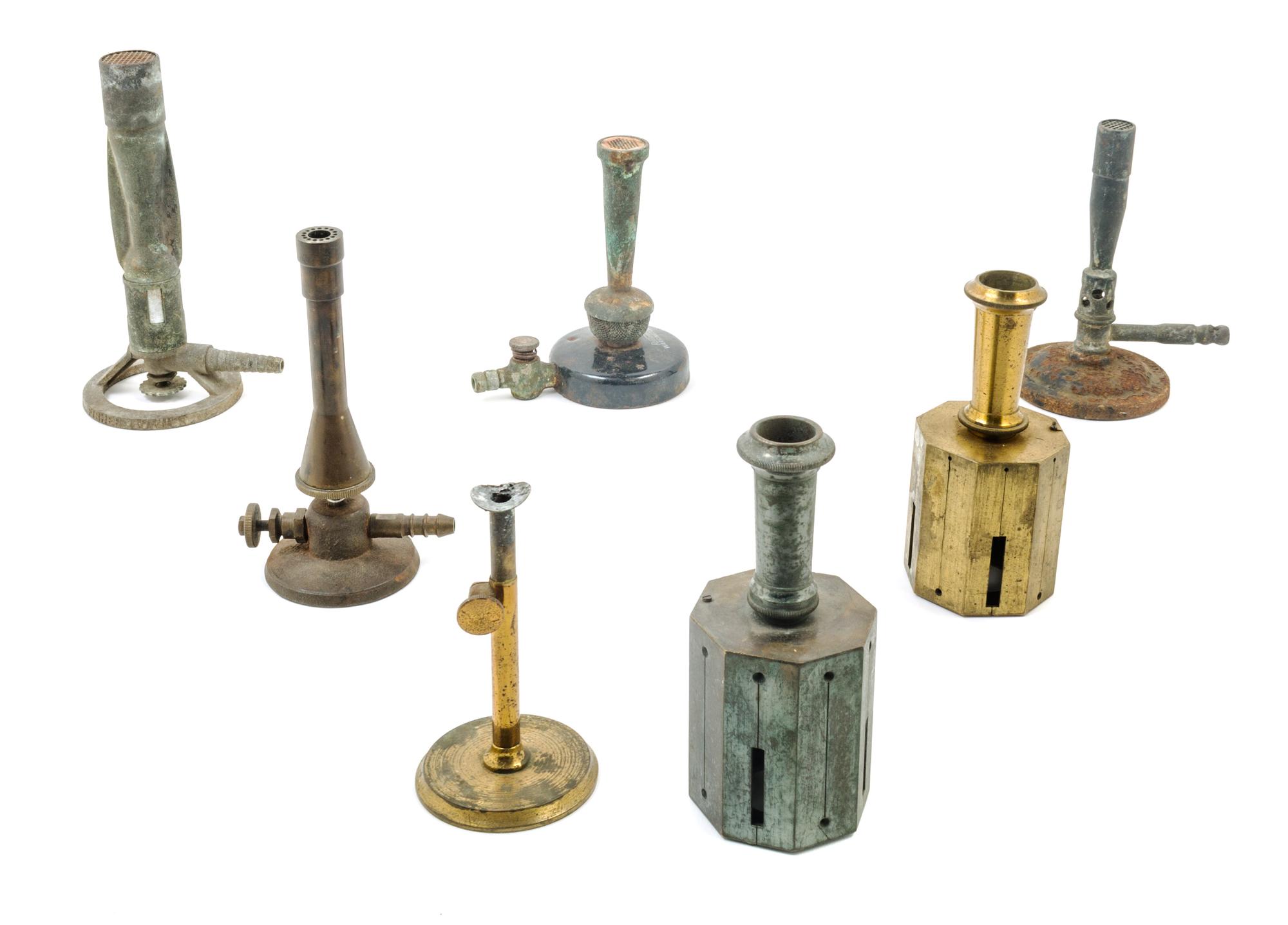 A Group of Seven Bunsen Burners Height of tallest 7 1/2 inches. — VARIOUS MAKERS