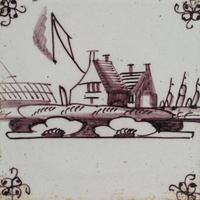 A Set of Five Framed Puce Delft Tiles