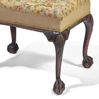 A George III Style Carved Mahogany Stool with Needlepoint Upholstery