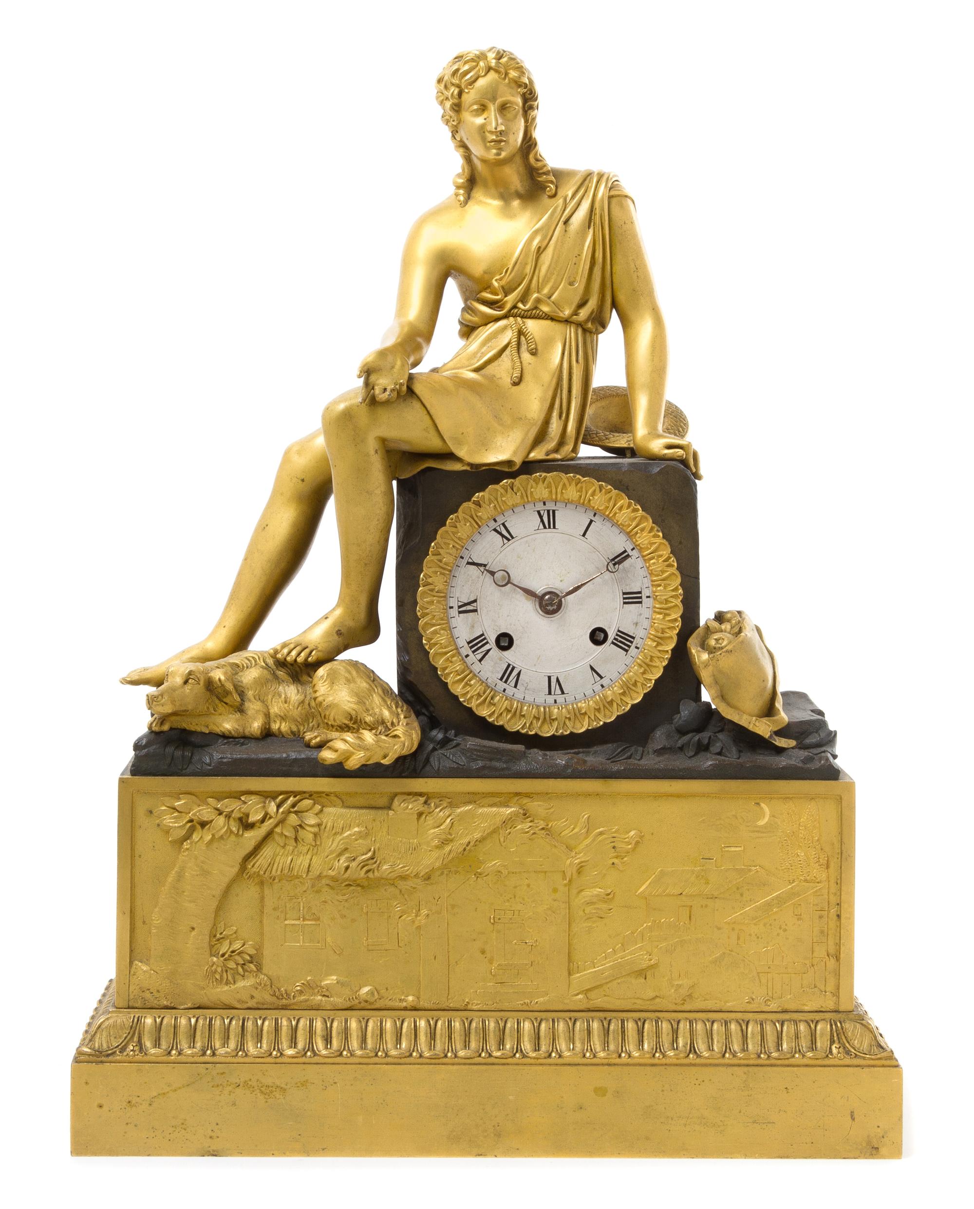 An Empire Gilt and Patinated Bronze Mantel Clock Height 16 1/4 inches. — EARLY 19TH CENTURY