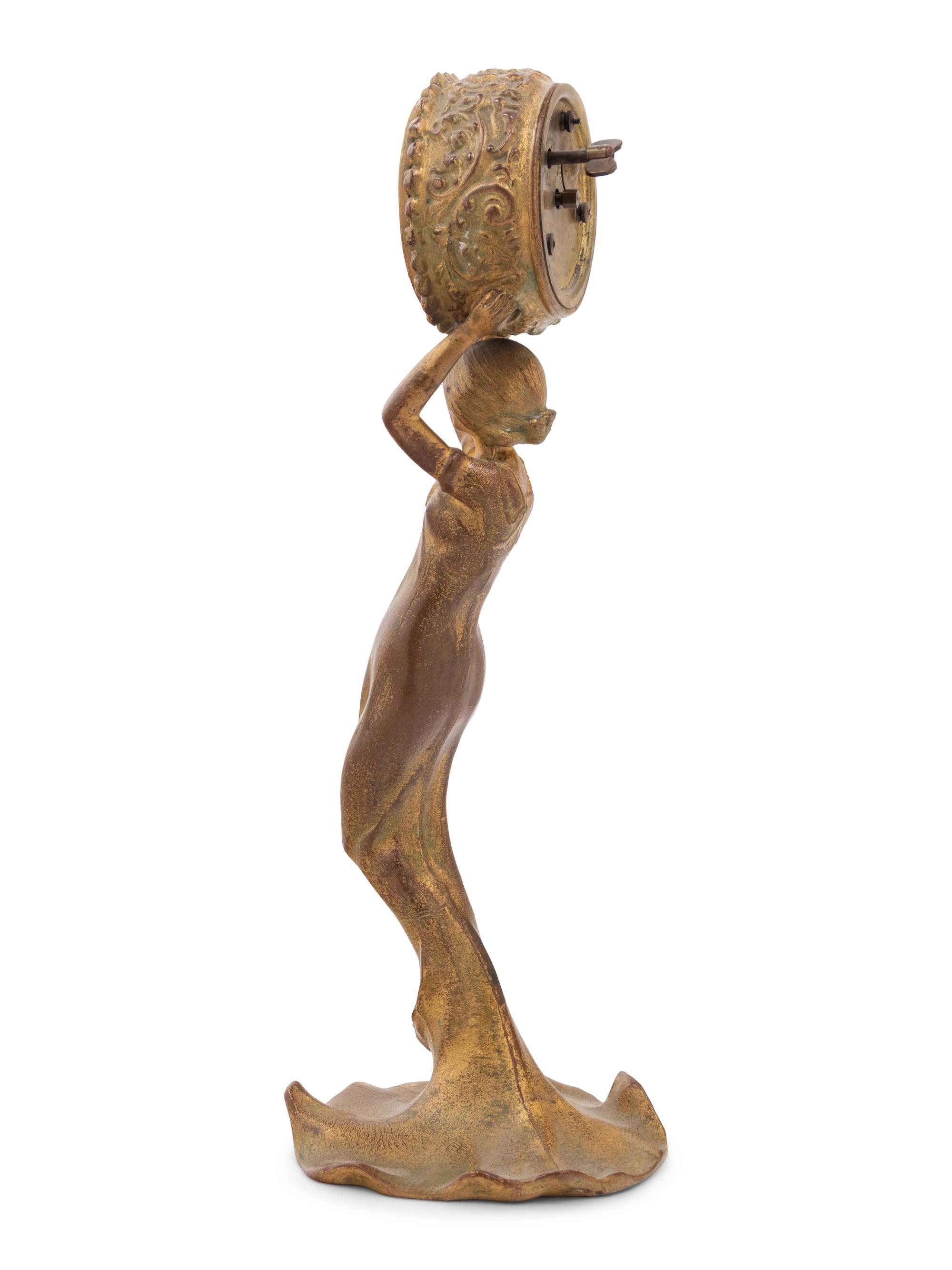 A New Haven Clock Co. Gilt Metal Figural Table Clock