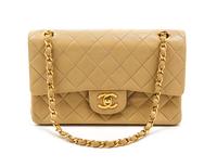 A Chanel Black Chevron Quilted Suede Convertible Bag, 9 x 5 1/2 x 1 inches.
