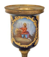 A Pair of Small Sevrés Style Porcelain and Gilt Bronze Urns