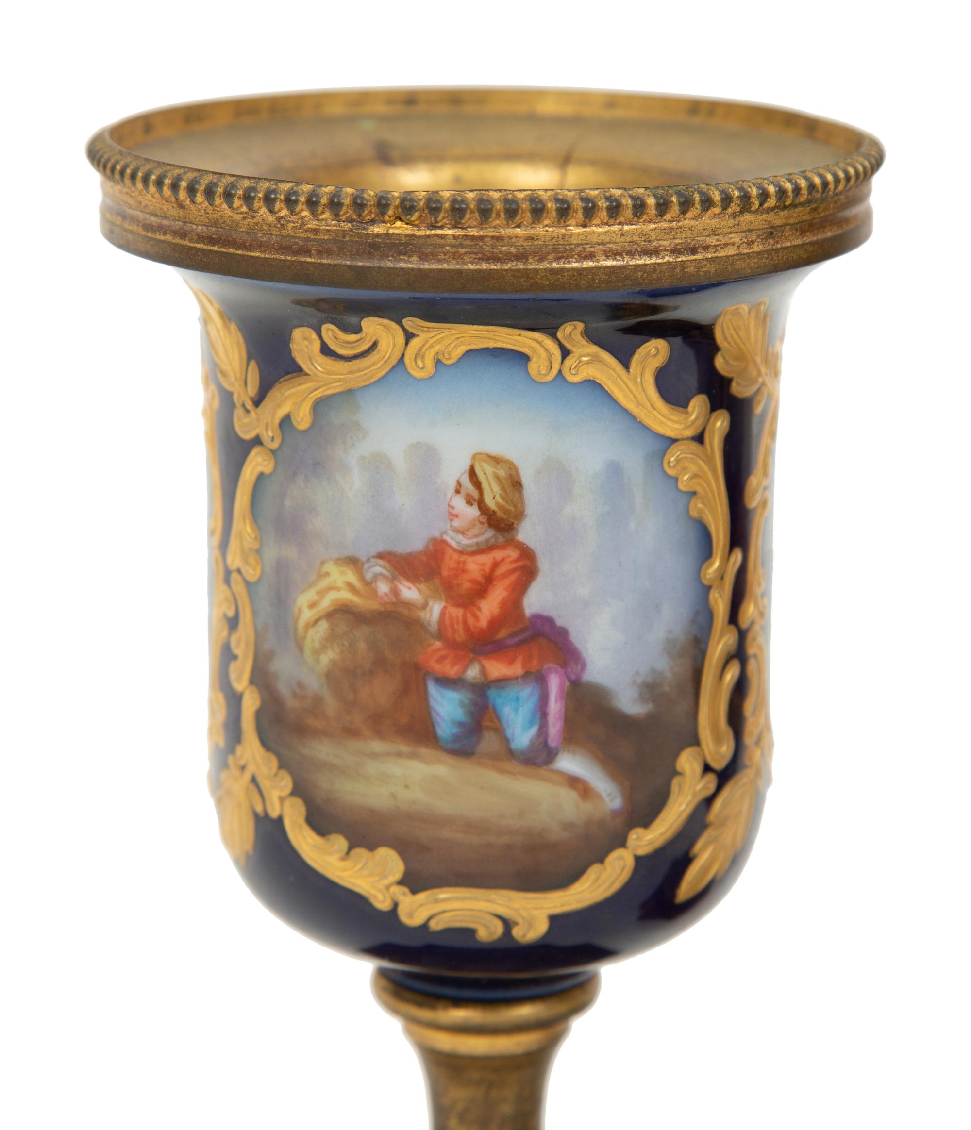 A Pair of Small Sevrés Style Porcelain and Gilt Bronze Urns