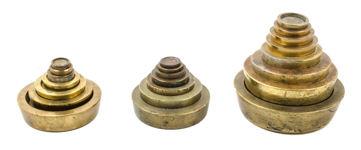 Three Sets of Stackable Brass Weights Diameter of largest weight 5 inches. — LATE 19TH/EARLY 20TH CENTURY