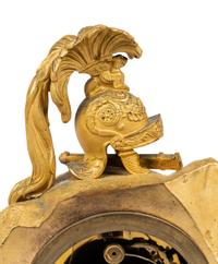 An Empire Gilt and Patinated Bronze Figural Mantel Clock