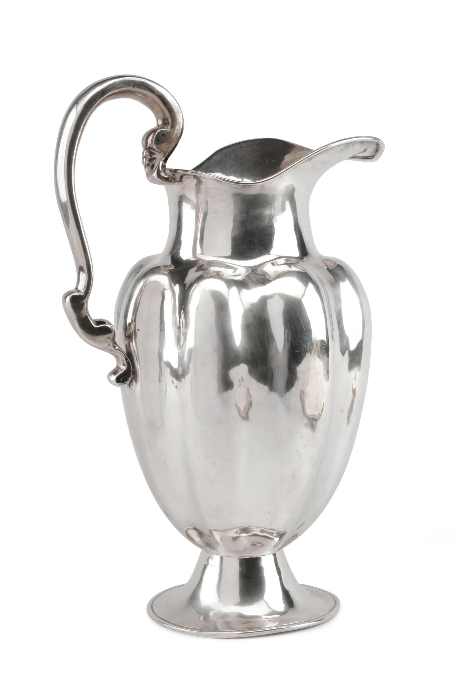 A Mexican Silver Water Pitcher, Conquistador S.A., Mexico City, 20th Century, of lobed baluster form, raised on a trumpet base.