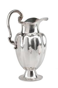 A Mexican Silver Water Pitcher, Conquistador S.A., Mexico City, 20th Century, of lobed baluster form, raised on a trumpet base.