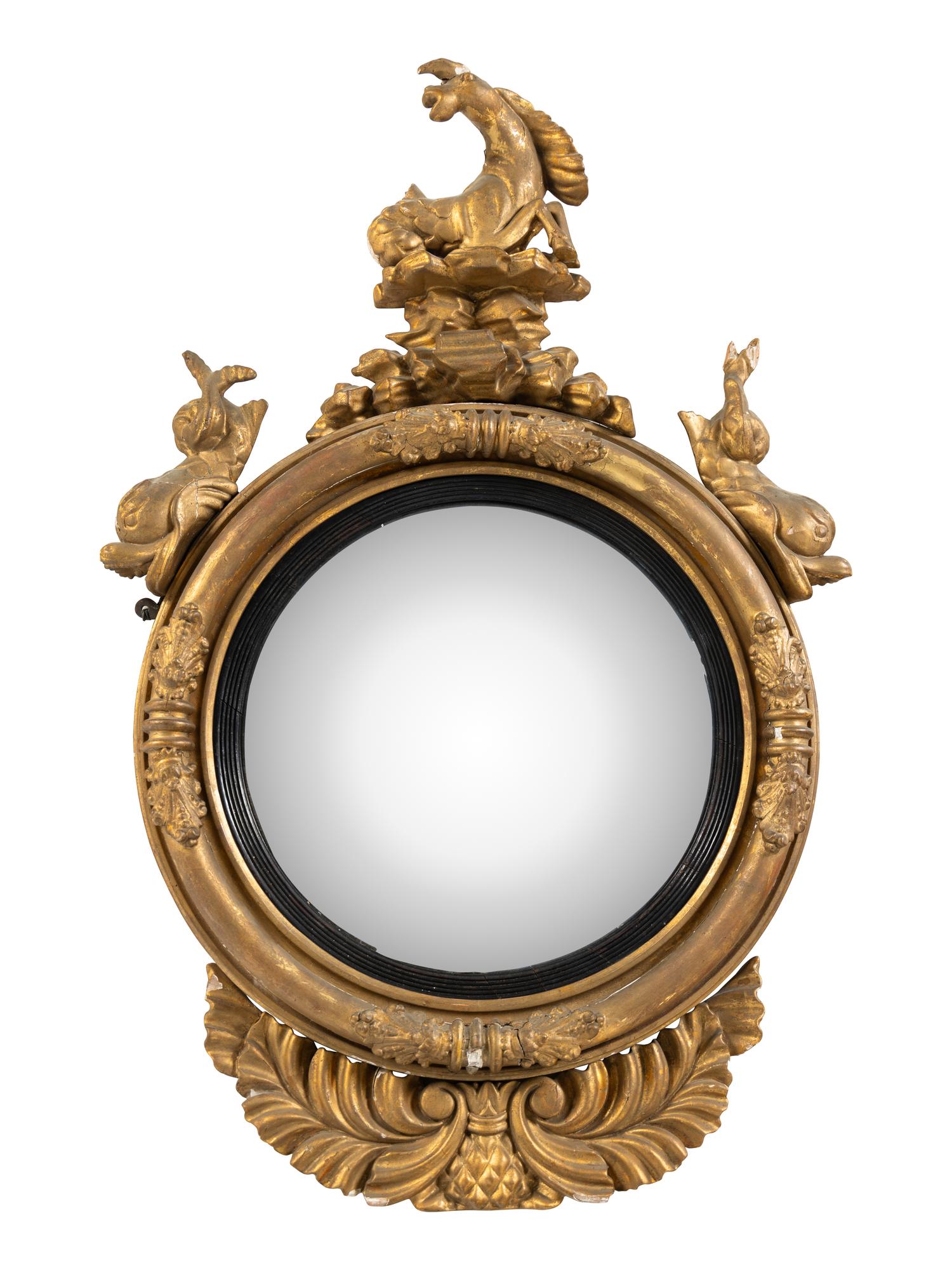 A Regency Part Ebonized Giltwood Convex Mirror
