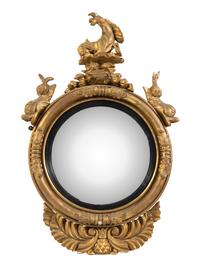 A Regency Part Ebonized Giltwood Convex Mirror