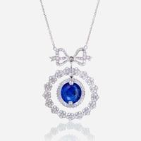 A sapphire, diamond, and eighteen karat white gold necklace