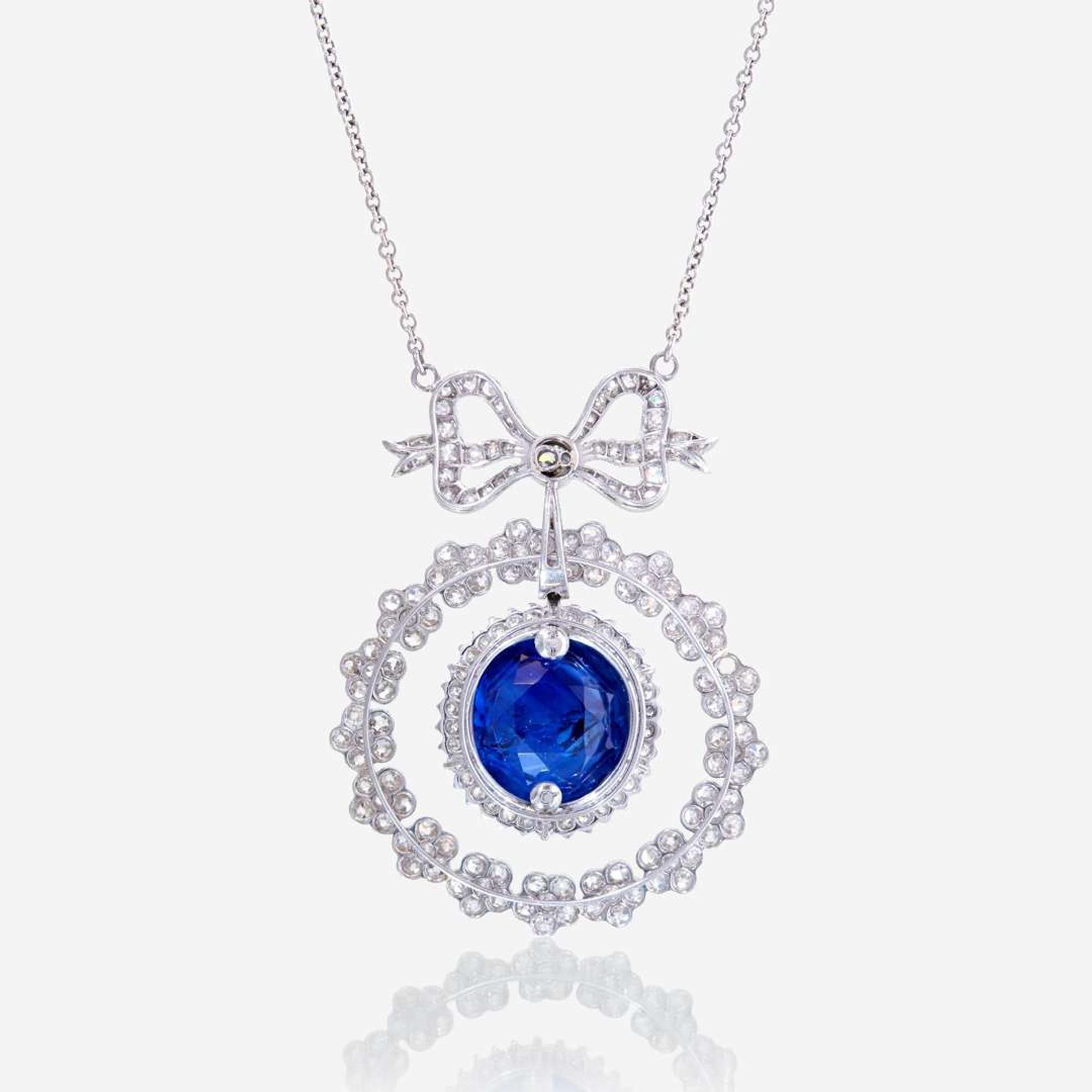 A sapphire, diamond, and eighteen karat white gold necklace