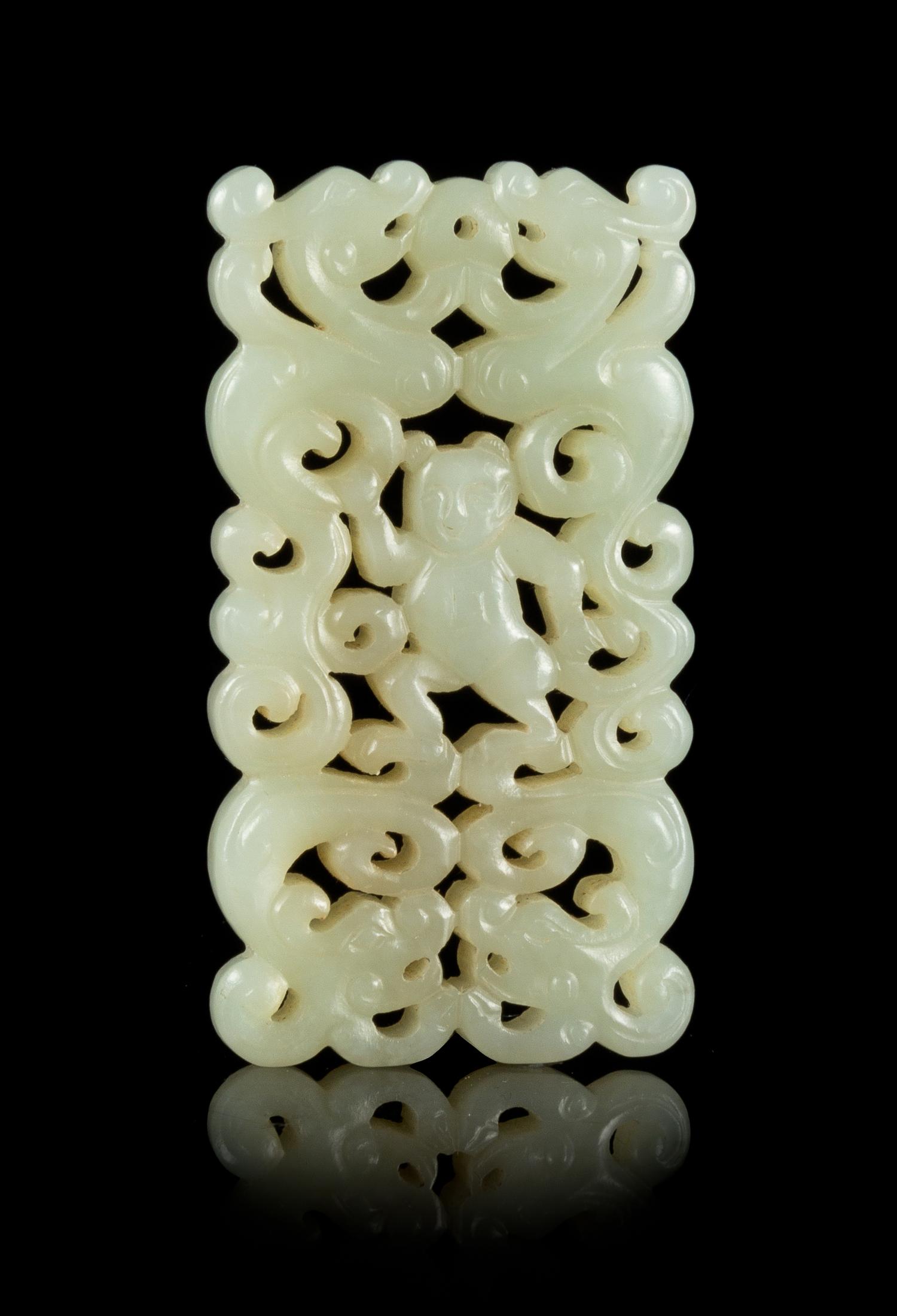 A Carved Celadon Jade Pendant Length 2 3/4 x width 1 3/8 inches.