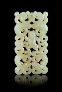 A Carved Celadon Jade Pendant Length 2 3/4 x width 1 3/8 inches.
