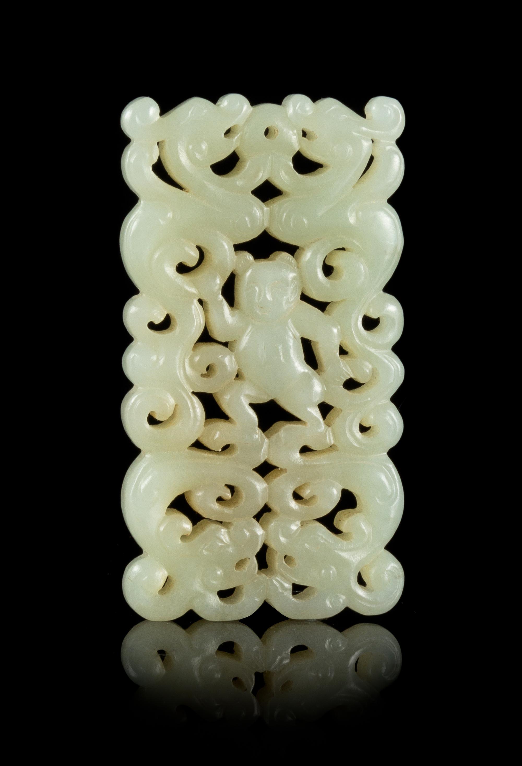 A Carved Celadon Jade Pendant Length 2 3/4 x width 1 3/8 inches.