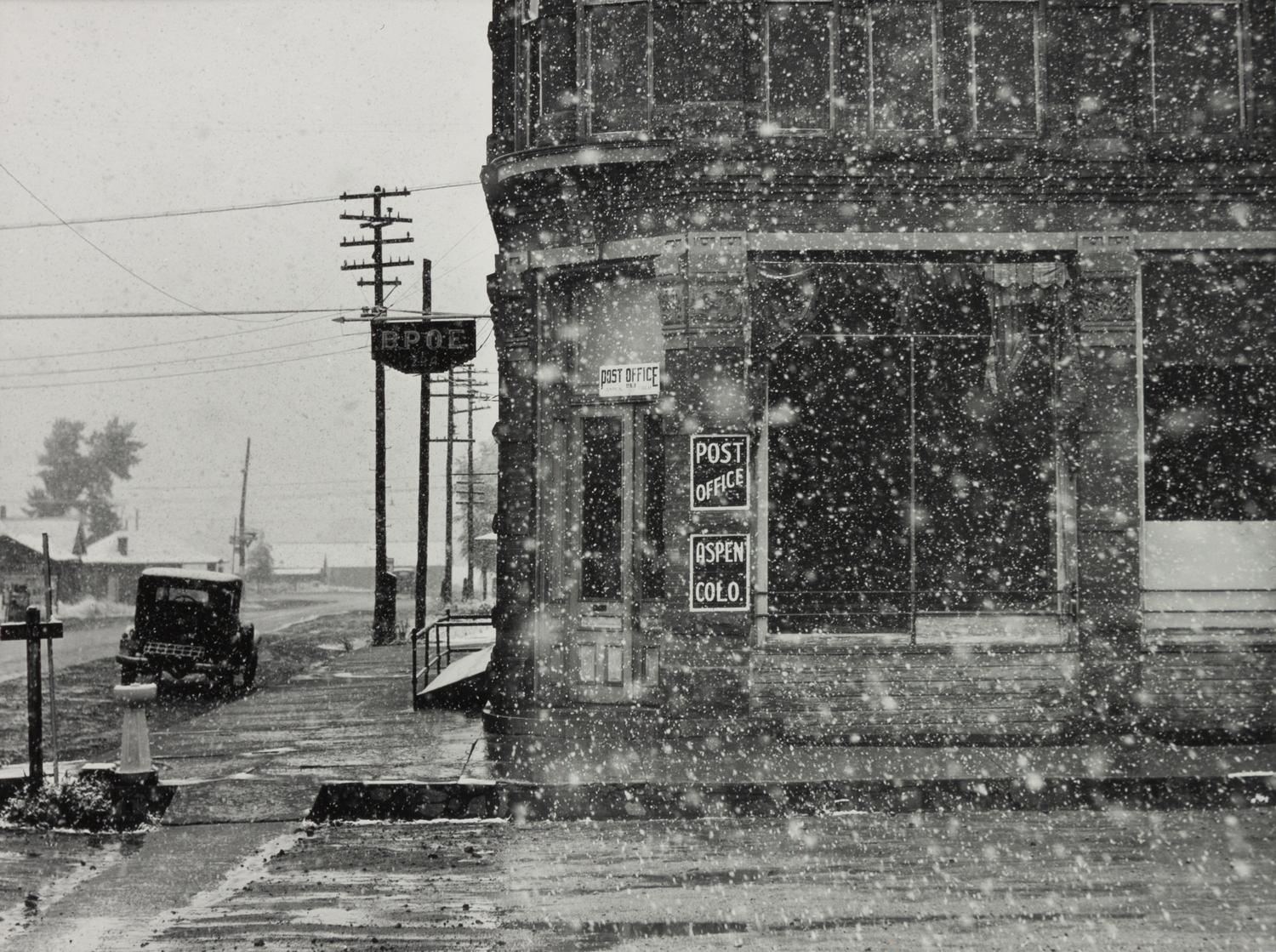 A group of five photographs ( A member of the Wilkins Family Making Biscuits , 1939; Post Office in Blizzard, Aspen, CO , 1941; Negro (Black) Man Entering Movie Theater by Colored Entrance, Belzoni, Miss., 1939; Crossroad and General Store (Mosquito Crossing) Near Greensboro, GA, 1939 (printed 1981); Recreation Evening at Community School Under Direction of WPA Recreational Supervisor (in suit and tie) Coffee County, Alabama, 1939)