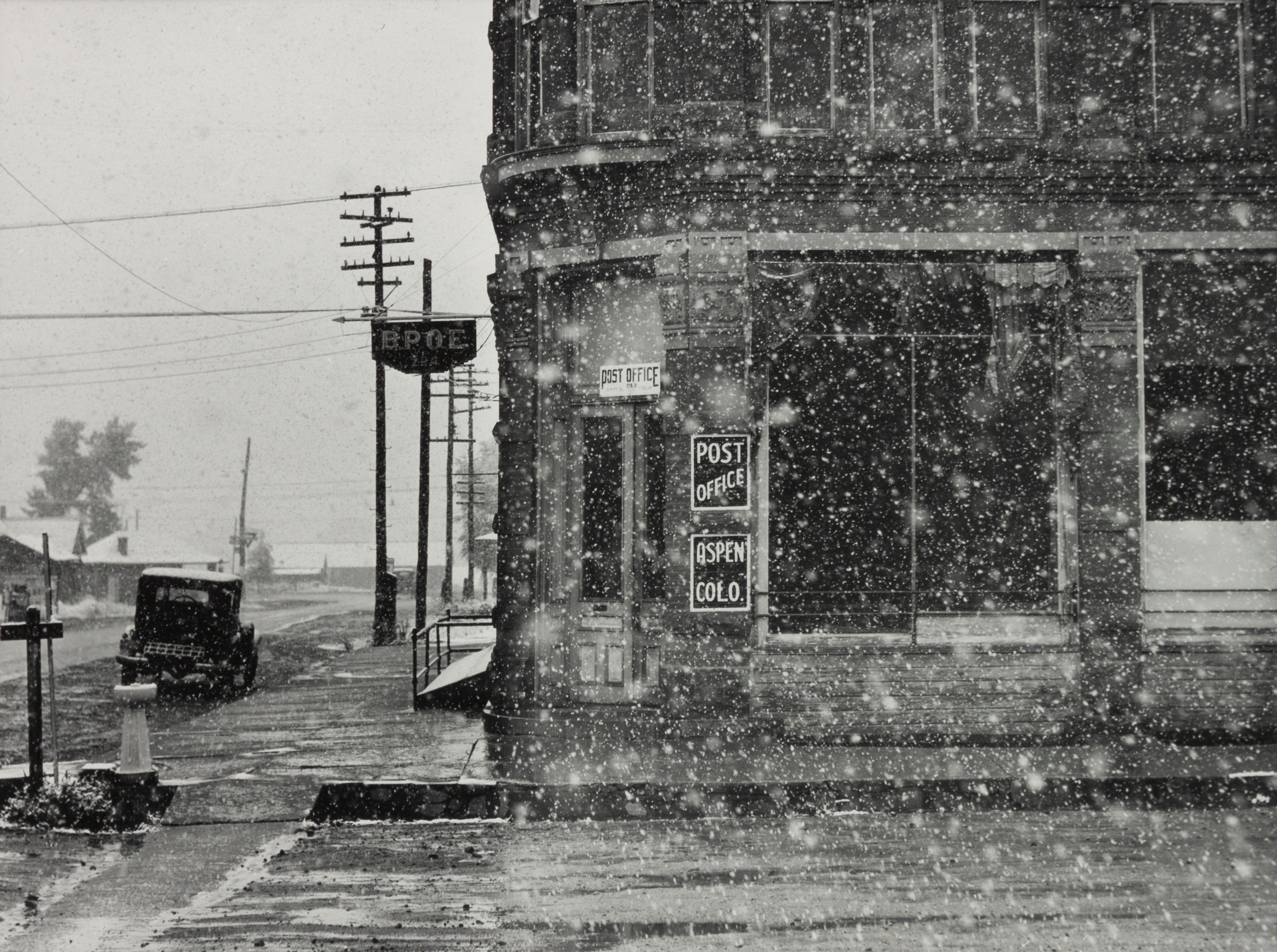A group of five photographs ( A member of the Wilkins Family Making Biscuits , 1939; Post Office in Blizzard, Aspen, CO , 1941; Negro (Black) Man Entering Movie Theater by Colored Entrance, Belzoni, Miss., 1939; Crossroad and General Store (Mosquito Crossing) Near Greensboro, GA, 1939 (printed 1981); Recreation Evening at Community School Under Direction of WPA Recreational Supervisor (in suit and tie) Coffee County, Alabama, 1939)