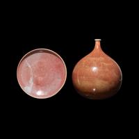 A Chinese Teardrop-Form Porcelain Vase and a Red Glazed Dish, Possibly Jin Dynasty and Later 金或更晚 紅釉瓶及碟