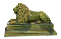 A Green Glazed Ceramic Recumbent Lion Height 23 x width 16 x depth 36 inches. — 20TH CENTURY