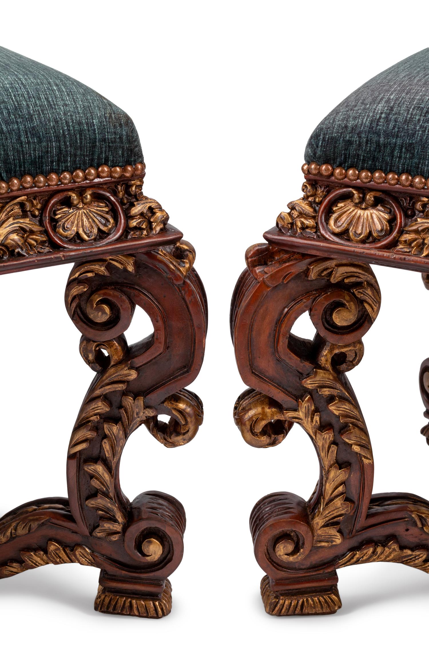 A Pair of Italian Baroque Style Carved and Parcel Gilt Benches
