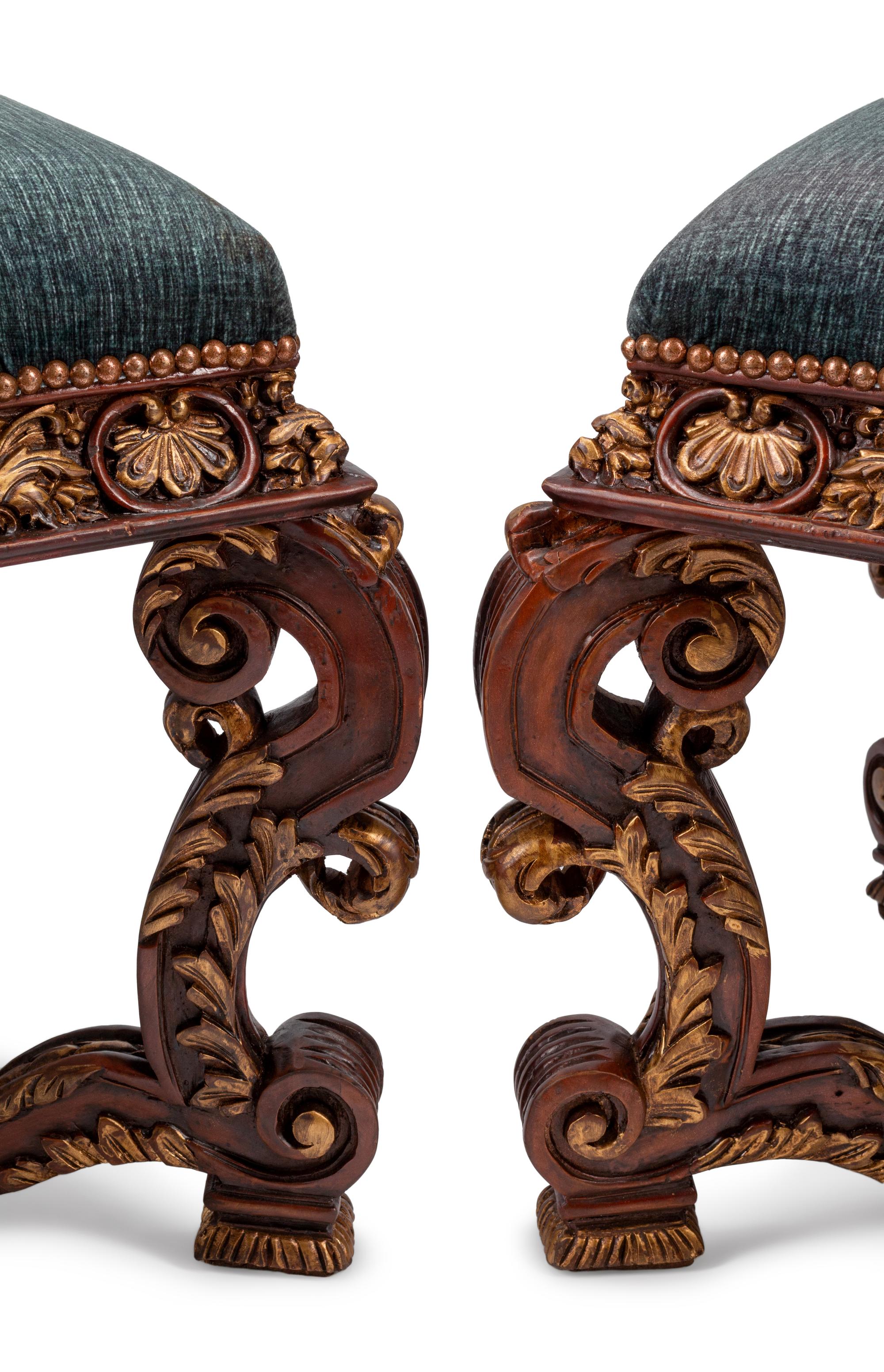 A Pair of Italian Baroque Style Carved and Parcel Gilt Benches