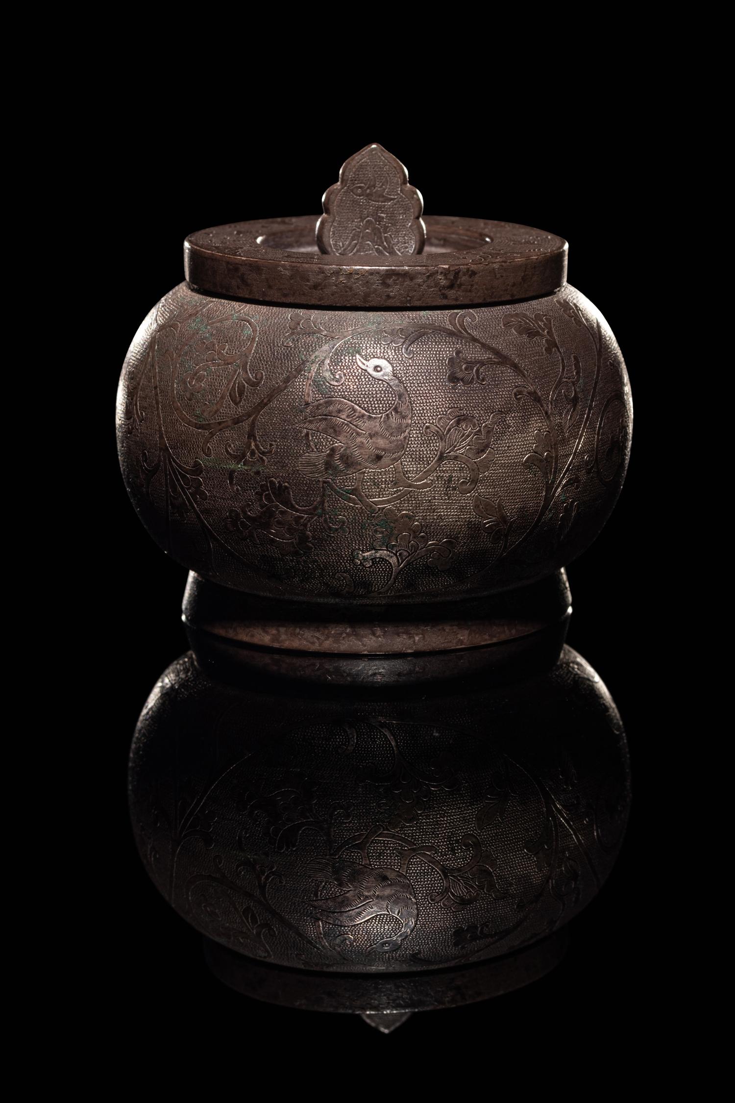 An Incised Silver Covered Jar
