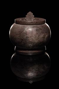 An Incised Silver Covered Jar