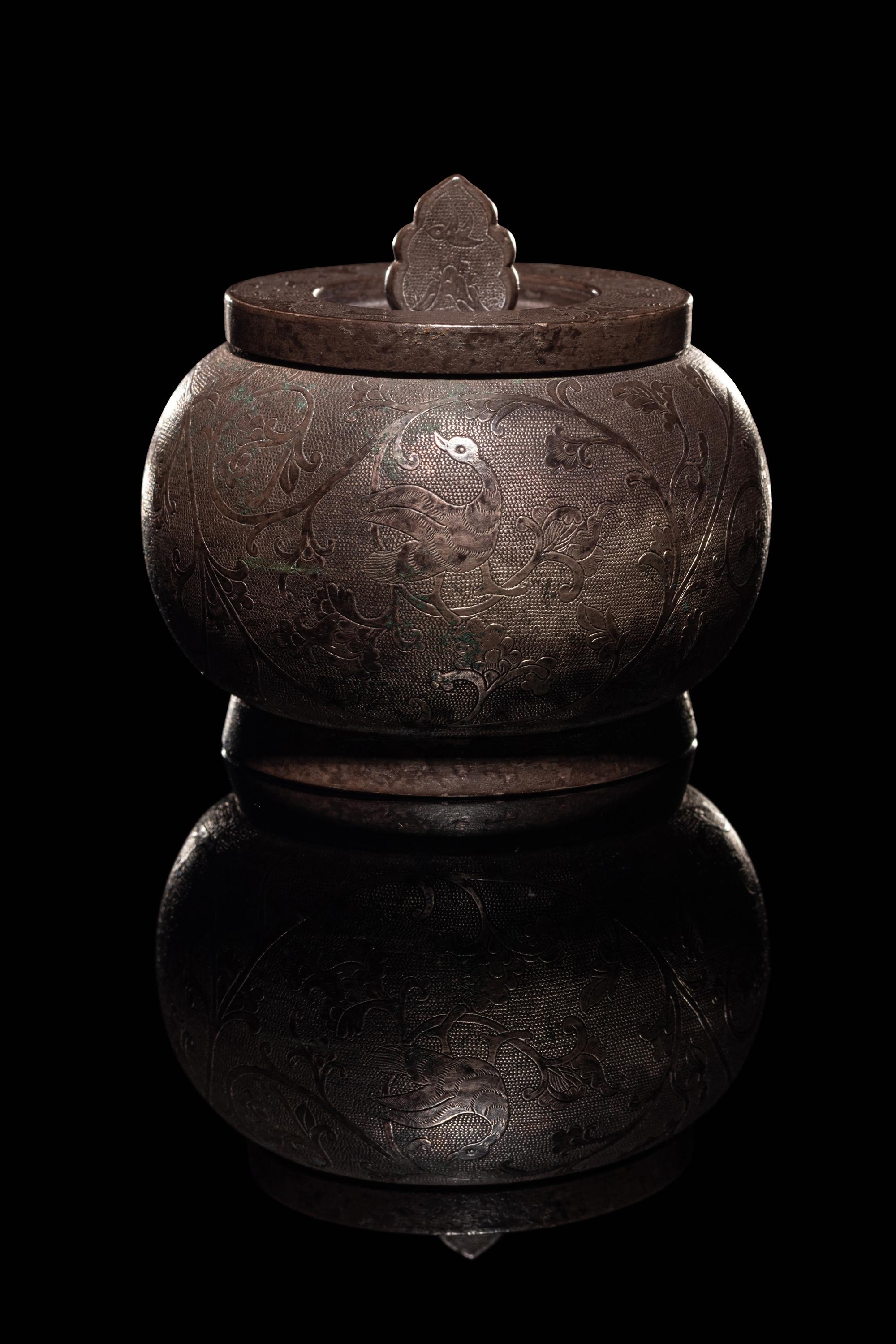 An Incised Silver Covered Jar