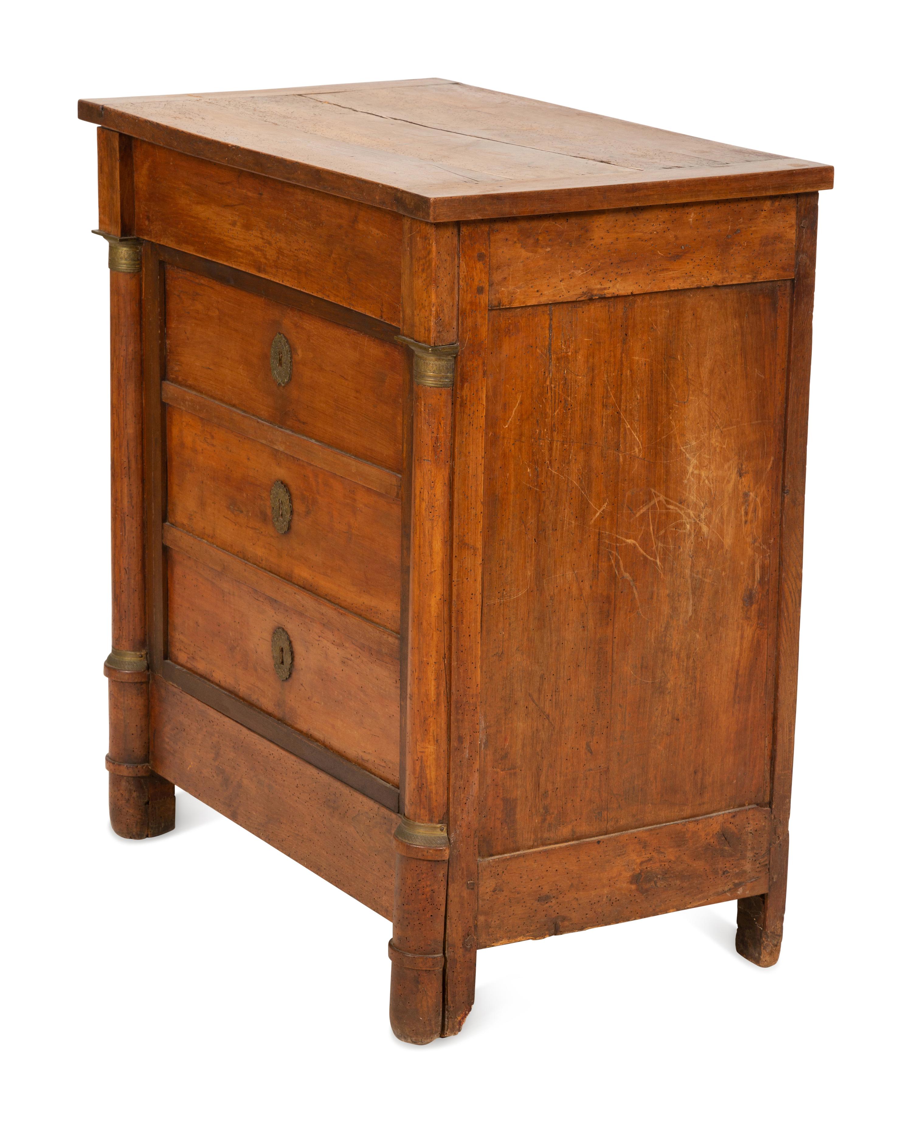 An Empire Walnut Cabinet