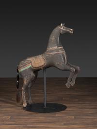 An American Glass Inset, Carved and Painted Pine Carousel Horse