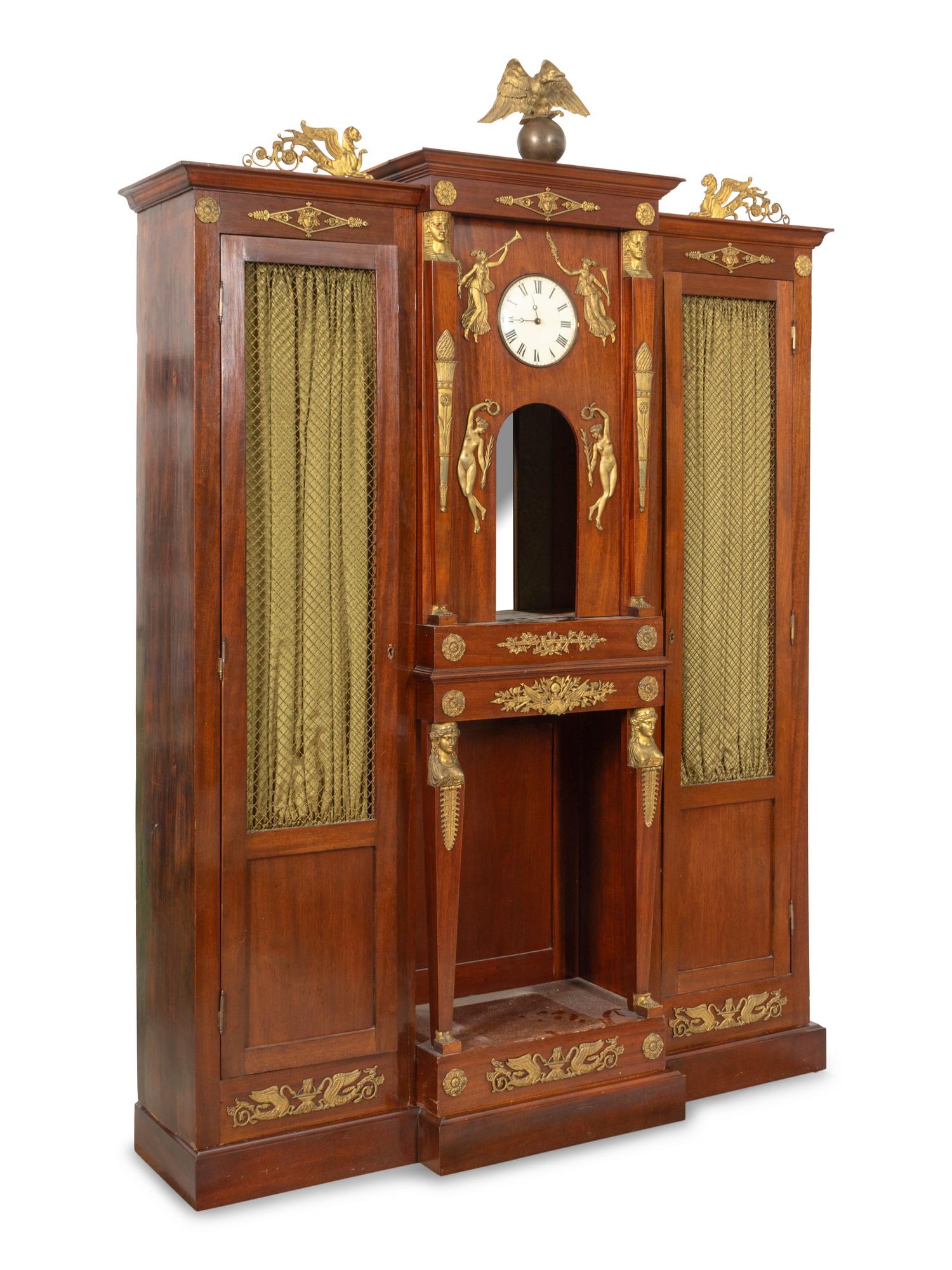 An Empire Style Gilt Bronze Mounted and Clock-Inset Biblioth èque