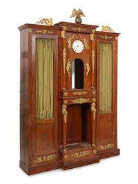 An Empire Style Gilt Bronze Mounted and Clock-Inset Biblioth èque