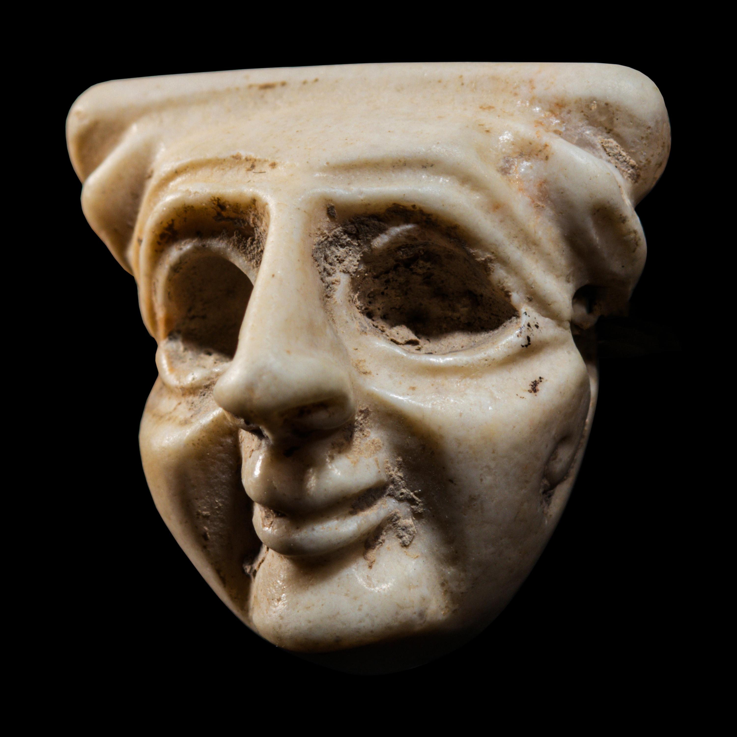 A Sumerian Limestone Face Amulet