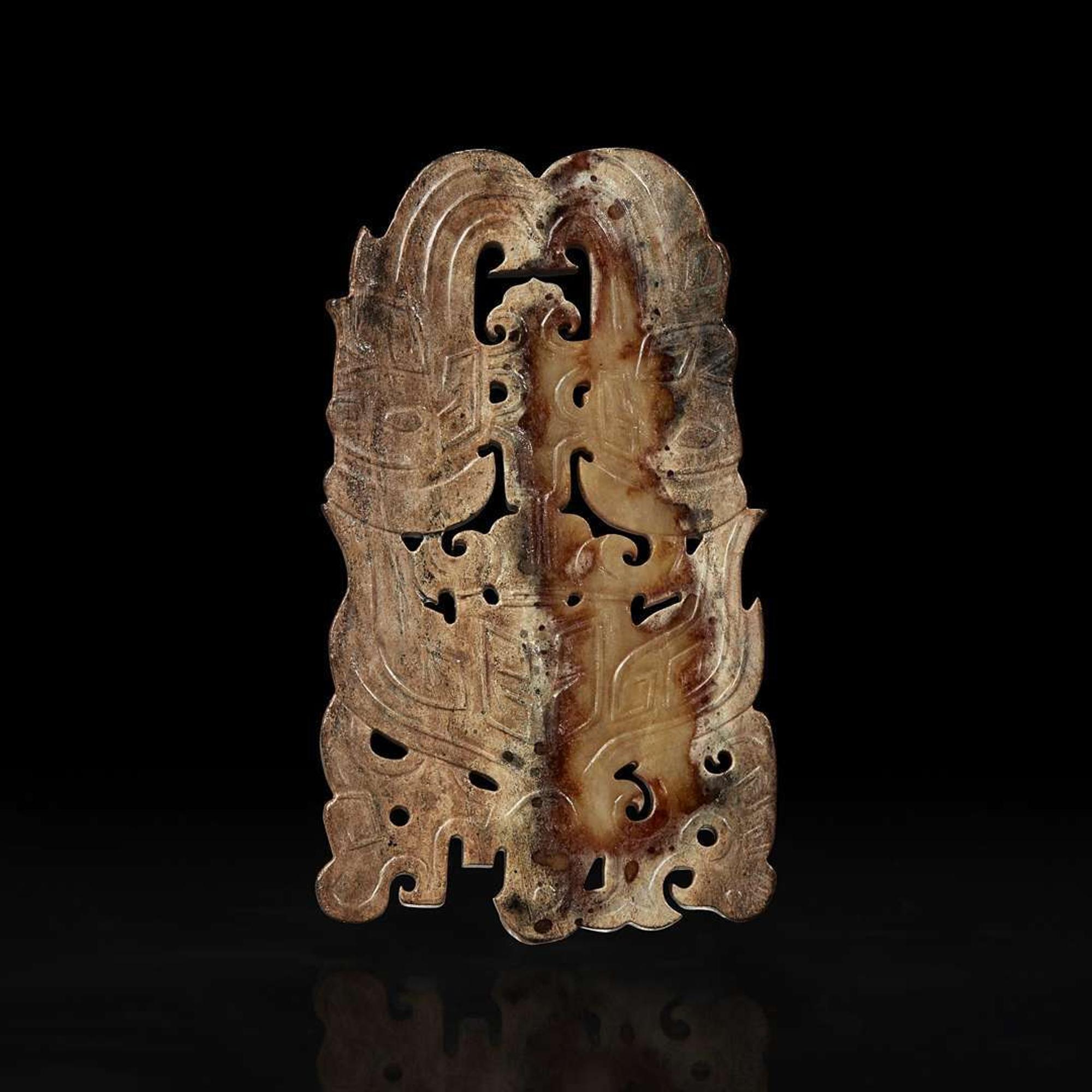 A Chinese archaistic carved beige and brown jade plaque 高古风格棕黄玉佩