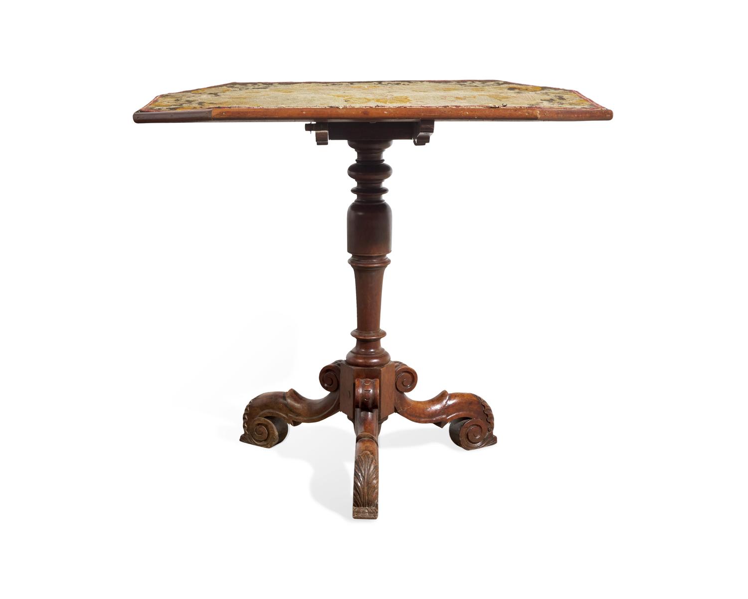 A Victorian Baroque Revival Tilt-Top Table with Needlework Top