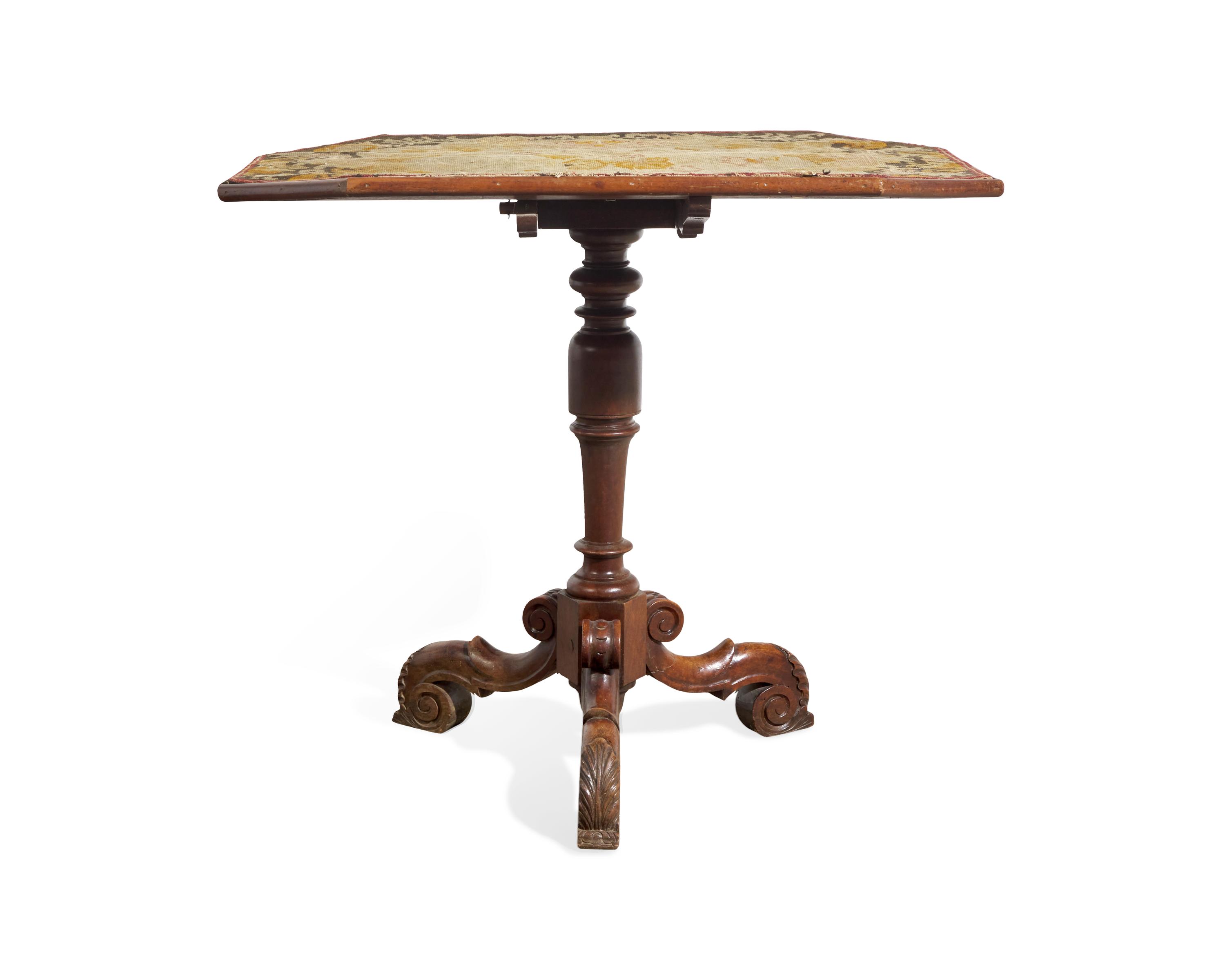 A Victorian Baroque Revival Tilt-Top Table with Needlework Top