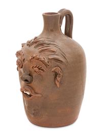 A Cole Pottery Glazed Stoneware Face Jug
