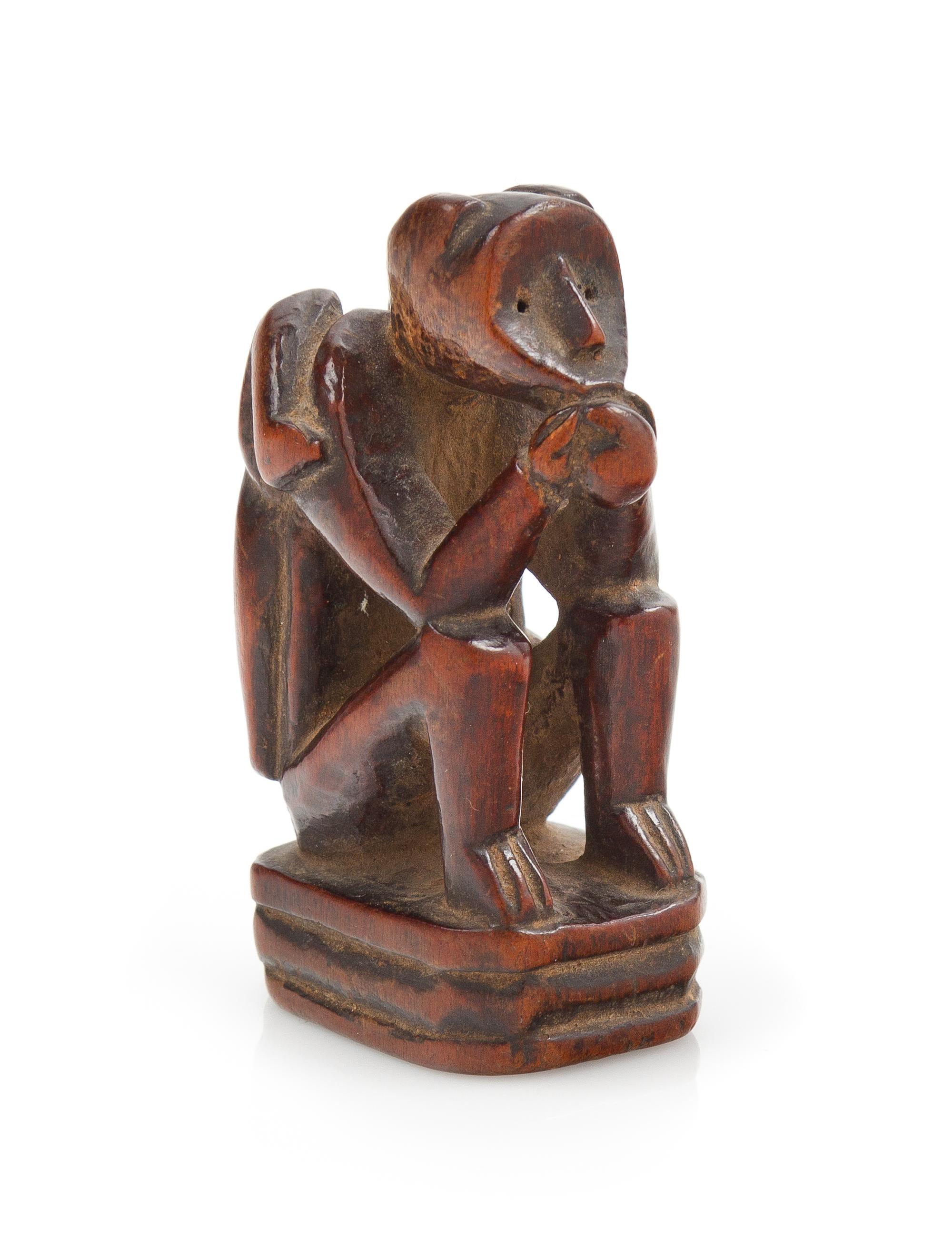A Japanese Carved Boxwood Netsuke Length 2 1/8 inches. — 19TH/20TH CENTURY