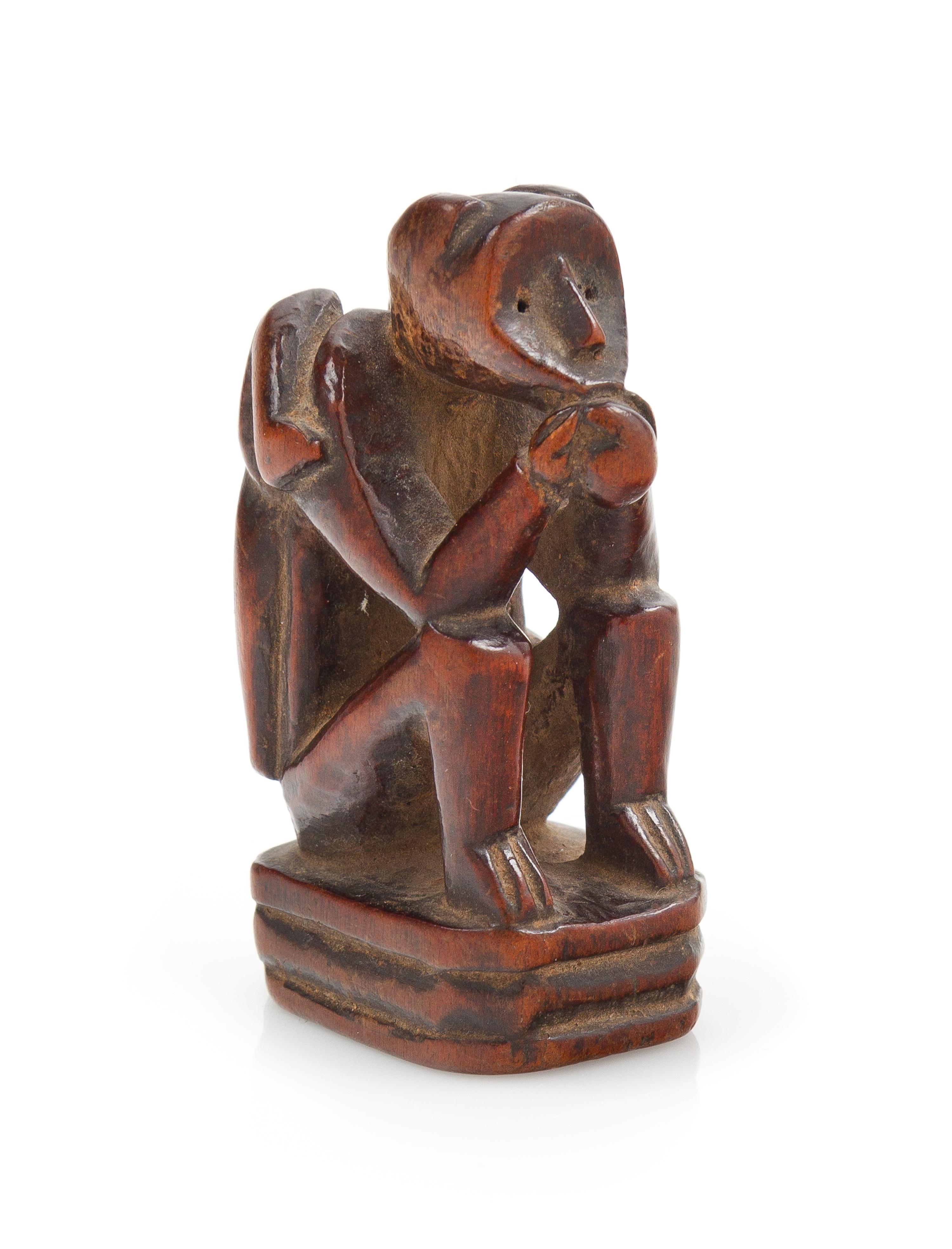 A Japanese Carved Boxwood Netsuke Length 2 1/8 inches. — 19TH/20TH CENTURY